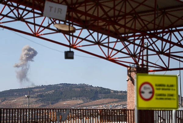 Smoke rises from the Syrian side as seen from the Oncupinar border gate on the
