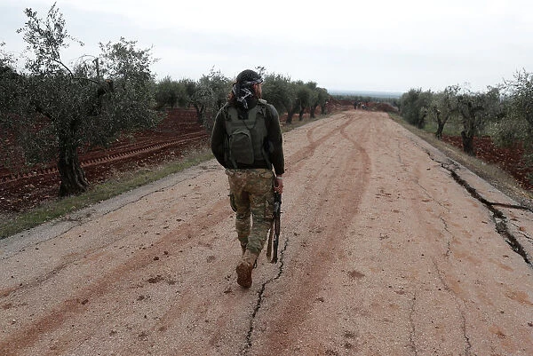 A Turkey-backed Free Syrian Army fighter is seen near Menagh