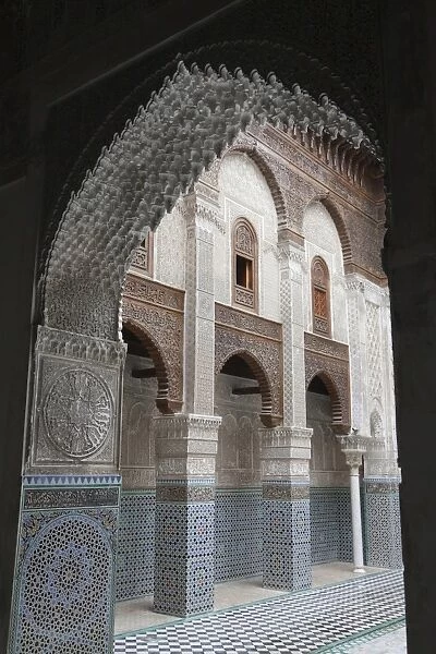 Madrasah courtyard with archway in city, Al-Attarine Madrasa, Fes el Bali, Fes, Morocco, april