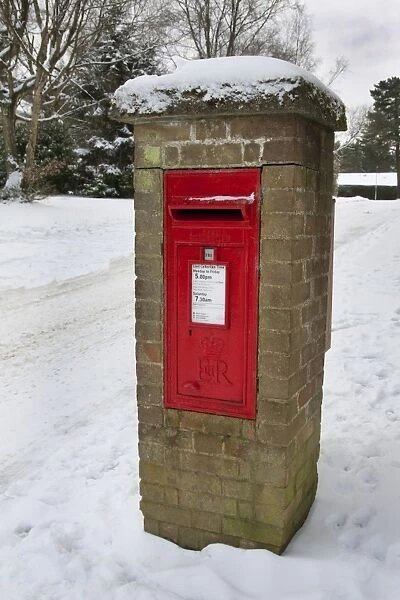 Royal Mail wall box postbox in snow, Grayshott, Hampshire, England, January