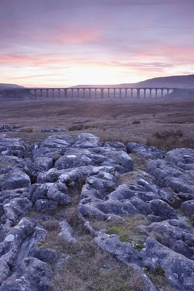 View of limestone rocks and Ribblehead Viaduct at sunset, Ribblehead, Ribblesdale, Yorkshire Dales N. P