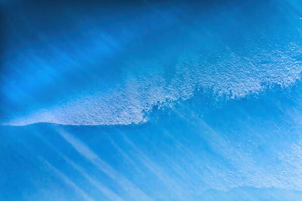 Blue iceberg closeup abstract background Charlotte Bay, Antarctica