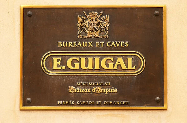 The brass sign at the entrance saying Bureaux et Caves E Guigal Siege Social au Chateau