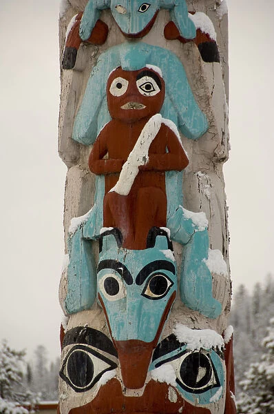 Canada, Alberta, Jasper. Snow covered totem pole
