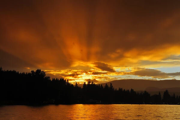Canada, British Columbia, Blind Bay. God rays at sunset on Sushwap Lake. Credit as