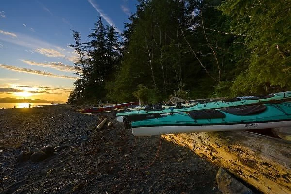 Canada, British Columbia, Vancouver Island, Johnstone Strait. Sea kayaks and sunrise