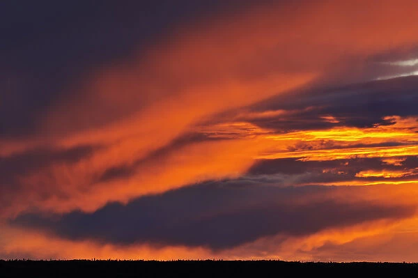 Canada, Saskatchewan. Storm over Prince Albert National Park at sunset. Credit as