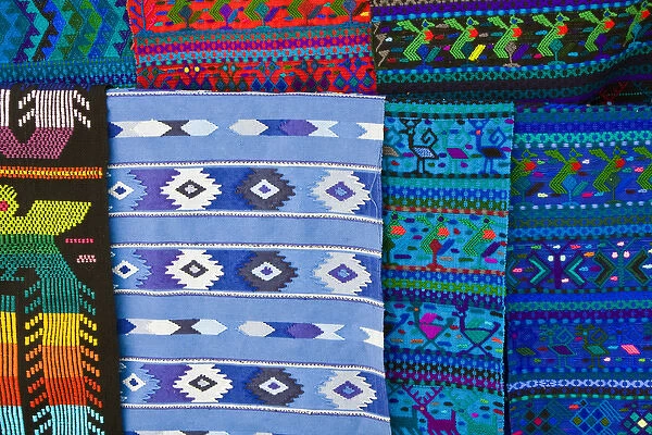 Central America, Guatemala, Santa Catarina. Colorful weavings for sale in the town