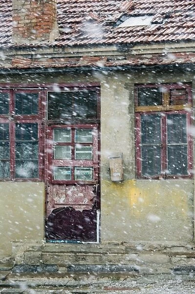 China, Shandong Province, Qingdao. Qingdao Old Town- Old Seaside House doorway in the snow