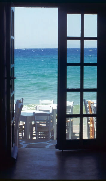 Europe, Greece, Cyclades, Island of Mykonos. View of ocean through restaurant door