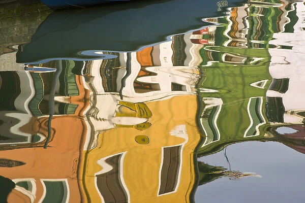 Europe, Italy, Burano. Colorful houses reflecting on canal