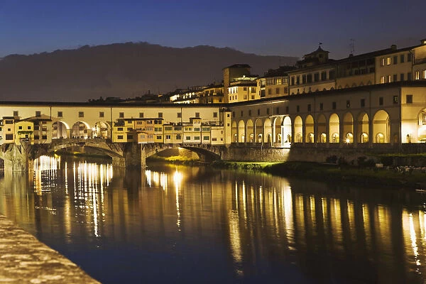 Europe, Italy, Florence. River Arno and the Ponte Vecchio at night