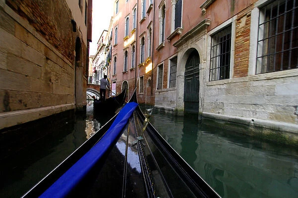 Europe, Italy, Venice. Typical gondola ride through the canals of Venice. UNESCO