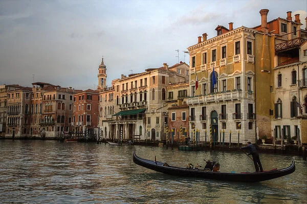 Evening light on Gondola along the Grand Canal near Rialto Bridge, Venice Italy