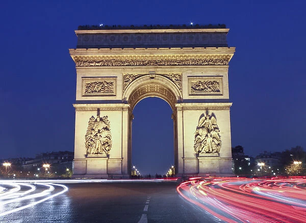 Evening traffic around the Arc de Triomphe, Paris, France