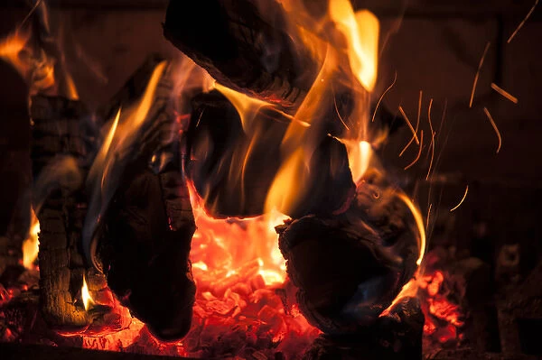 Flames licking wood