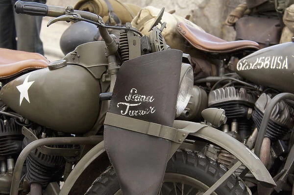 France, Normandy, Arromanches. Vintage military motorcycles on famous battlefield