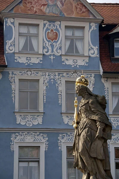 Germany, Bamberg. Royal statue of Kaiserin Kunigund in front of ornate blue & white