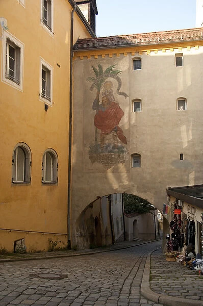Germany, Passau. Typical narrow cobblestone street of Passau, historic wall painting