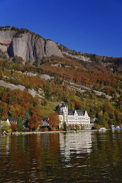 Hotel in autumn, along shore of Lake Lucerne from sightseeing boat, Lake Lucerne