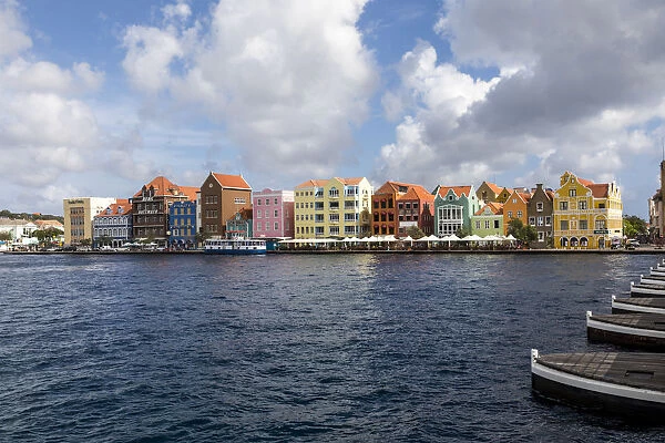 Lesser Antilles, Curacao, Willemstad. Colorful shopping district along the water