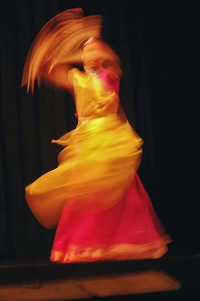 Long exposure, slow motion effect on tradiitional dancer, New Delhi, India