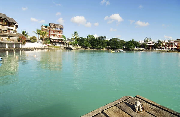 Mauritius, Grand Baie, a small teddy bear on pier by river with turquoise water surrounded