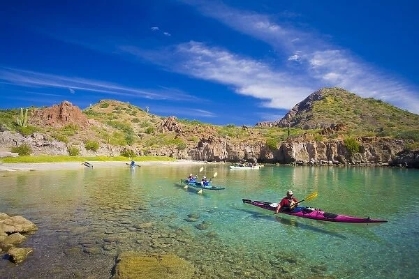 Mexico, Baja, Sea of Cortez. Sea Kayakers in Honeymoon Cove, Danzante Island. (MR)