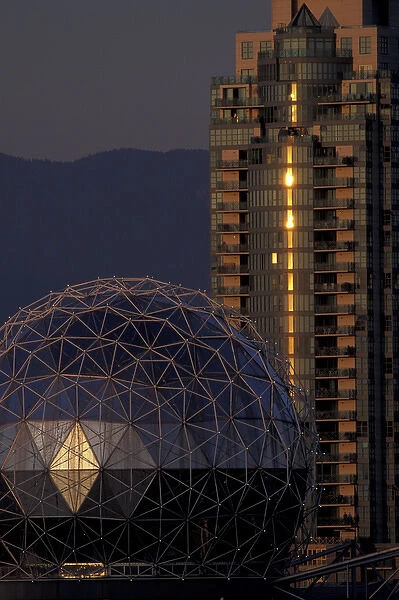 N. A. Canada, Vancouver, B. C. Science World Dome and building, lit by setting sun