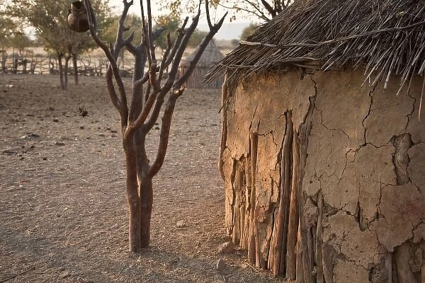 Namibia, Opuwo. Partial view of mud hut and Himba village