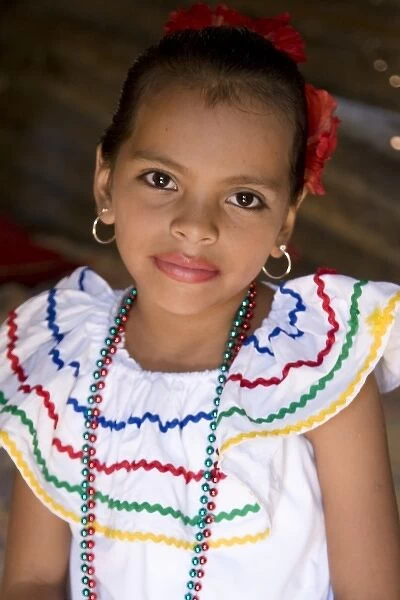 Nicaragua, Granada. Girl in traditional dress after dance in Villa Esperanza barrio. (MR)