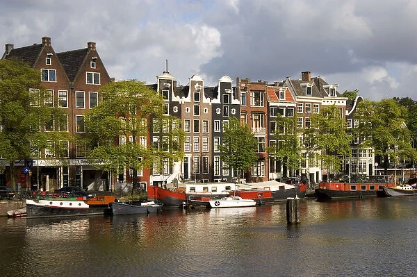 Row houses along the Amstel River in Amsterdam, Netherlands
