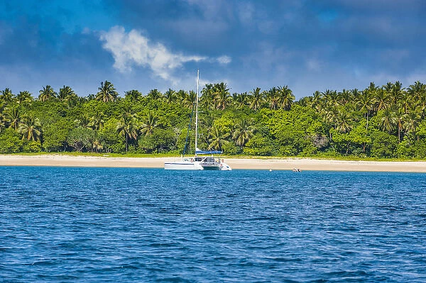 Sailing boat anchoring on the white sand beach of Haa'apai, Haapai, islands, Tonga