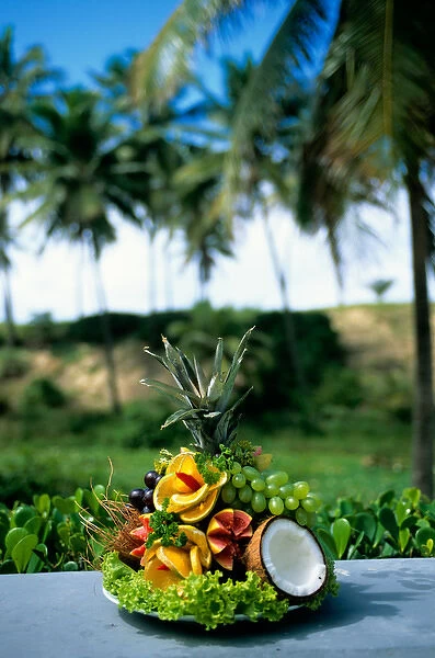 Sauipe, Brazil. Display of fresh fruits; pineapple, papaya, orange, guava, grapes, cocnut