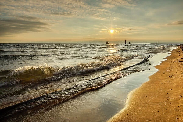 Shoreline of Lake Michigan and distant Grand Haven Lighthouse and pier, Grand Haven