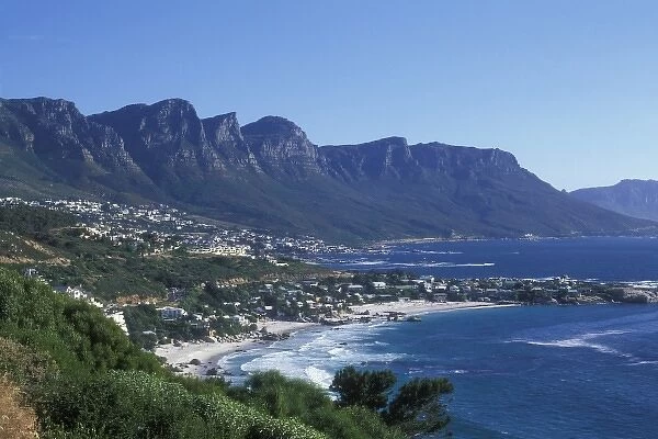 South Africa, Cape Town, Afternoon sun lights Camps Bay and Twelve Apostles mountains