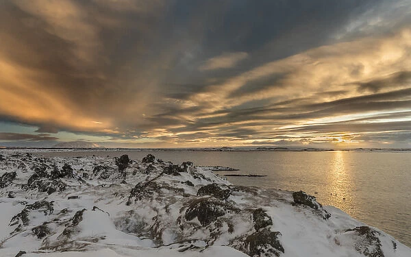 Sunset over lake Myvatn in the highlands of Iceland during winter with lava rock formations