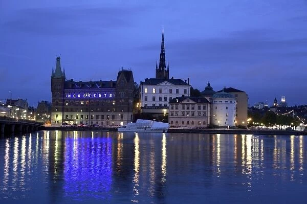 Sweden. Stockholm. The night view of Riddarholmen Island with the black spire of Riddarholmskyrkan