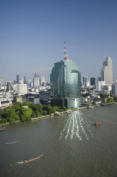 Thailand, Bangkok. Downtown Bangkok skyline view with Chao Phraya river