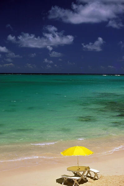 USA, Hawaii. Table and umbrella on beach