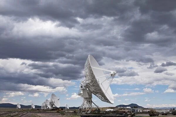USA, New Mexico, Socorro, Radio telescopes under summer storm clouds at VLA Radio
