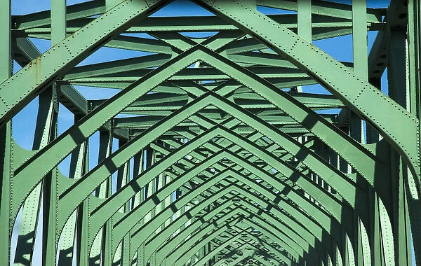 USA, Oregon, Bandon. Girders form pattern on bridge over the Rouge River. Credit as