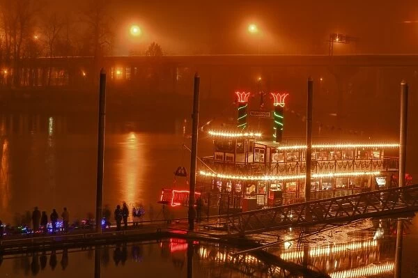 USA, Oregon, Salem, Riverfront Park, Willamette Queen decorated for Christmas surrounded