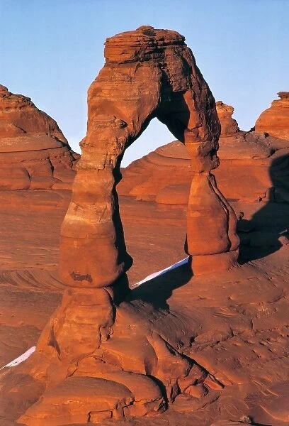 USA, Utah, Arches NP. The setting sun brings out the orange of the sandstone rock