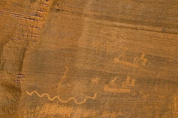 USA, Utah, Monument Valley Navajo Tribal Park. Ancient Kokopelli and other petroglyphs
