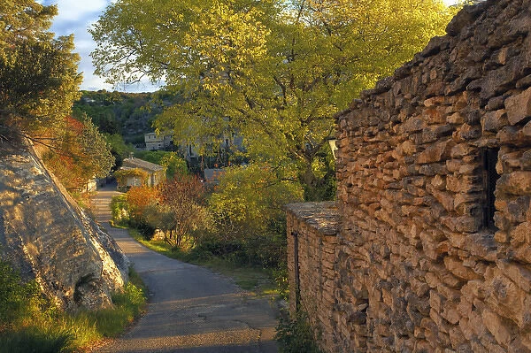 Walkway and trees at sunrise, Gordes, France
