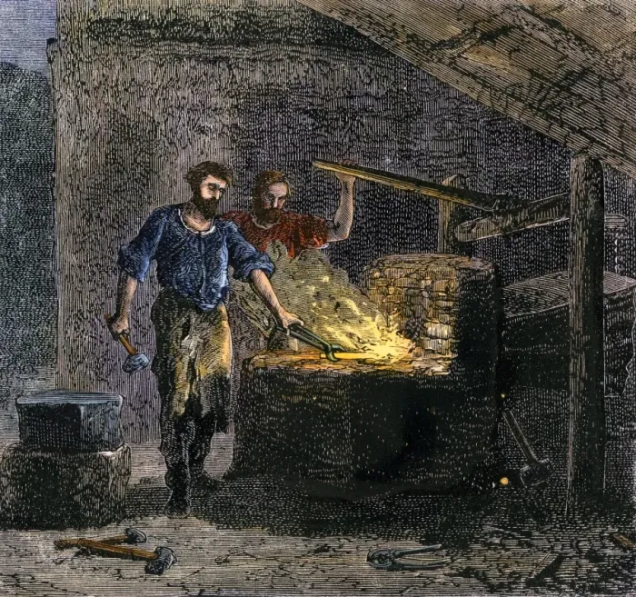 Framed Print : Blacksmith and his assistant at a forge Print