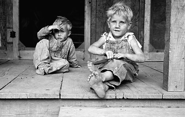 ARKANSAS: CHILDREN, 1935. Sharecroppers children seated on the porch of a shack