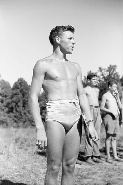 BOY SCOUT CAMP, 1942. A Boy Scout camp counselor overseeing a swimming class in Florence, Alabama