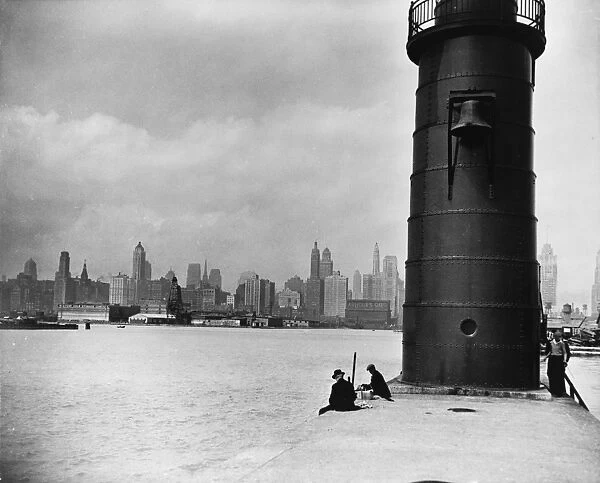 CHICAGO: SKYLINE, 1930. A view of a lighthouse at mouth of the Chicago River